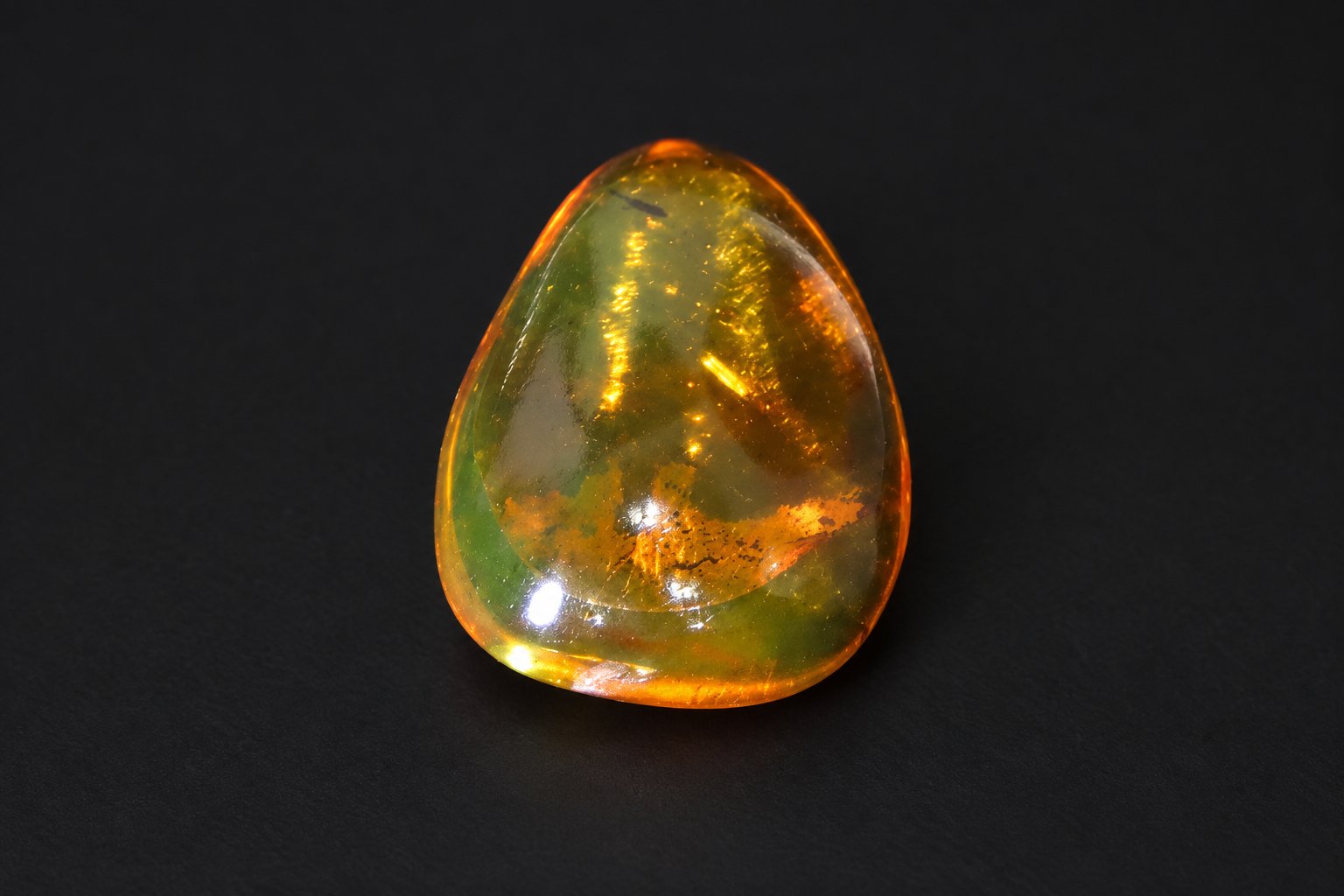 Authentic orange green Dominican amber cabochon – photo 3